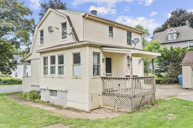 27 Homestead St, Manchester, CT 06042 - view of front of home featuring a front lawn, a chimney, and a deck