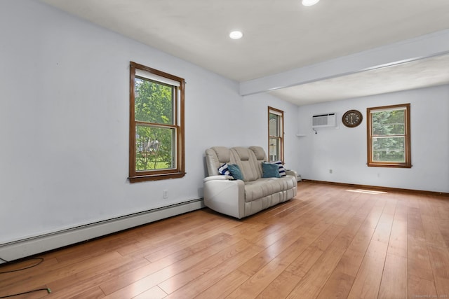 27 Homestead St, Manchester, CT 06042 - living area featuring baseboard heating, a wall mounted air conditioner, plenty of natural light, light wood-style flooring, and recessed lighting