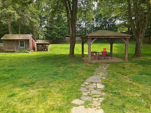 42 Meadowlark Rd, Enfield, CT 06082 - view of yard featuring a gazebo, a storage unit, and view of wooded area