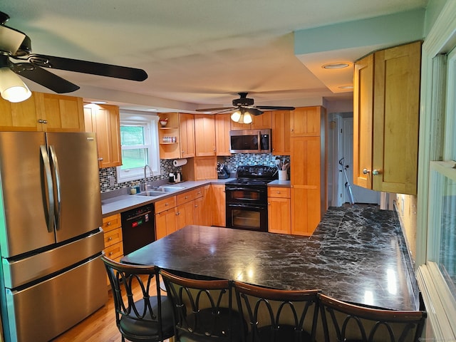 42 Meadowlark Rd, Enfield, CT 06082 - kitchen with black appliances, ceiling fan, a peninsula, backsplash, and open shelves