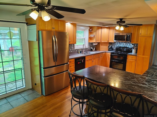42 Meadowlark Rd, Enfield, CT 06082 - kitchen featuring black appliances, a ceiling fan, decorative backsplash, open shelves, and light wood finished floors