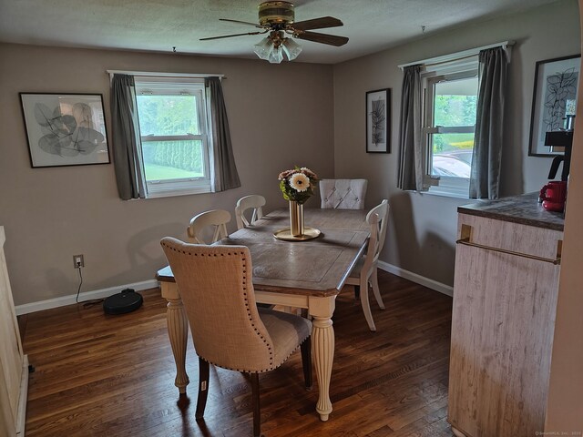 42 Meadowlark Rd, Enfield, CT 06082 - dining area featuring dark wood finished floors and ceiling fan