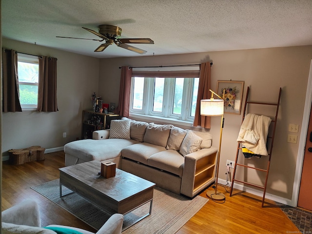 42 Meadowlark Rd, Enfield, CT 06082 - living area featuring plenty of natural light, ceiling fan, light wood-style flooring, and a textured ceiling