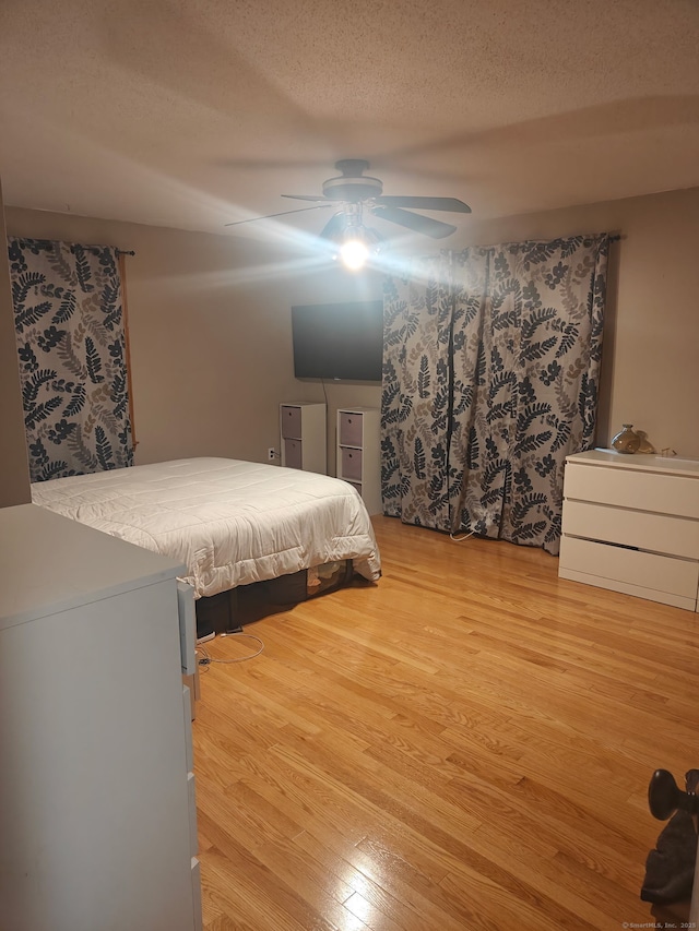 42 Meadowlark Rd, Enfield, CT 06082 - bedroom featuring light wood finished floors, a textured ceiling, and a ceiling fan