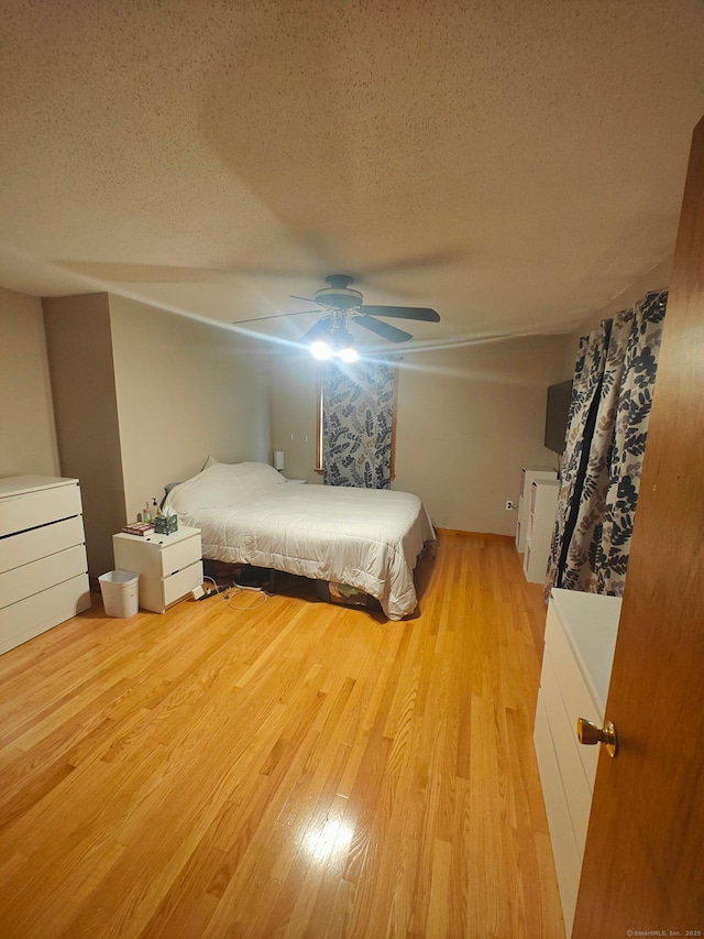 42 Meadowlark Rd, Enfield, CT 06082 - bedroom featuring a textured ceiling, light wood finished floors, and a ceiling fan