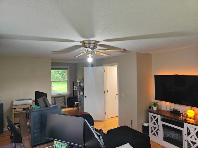 42 Meadowlark Rd, Enfield, CT 06082 - living area featuring ceiling fan, wood finished floors, a desk, and a textured ceiling
