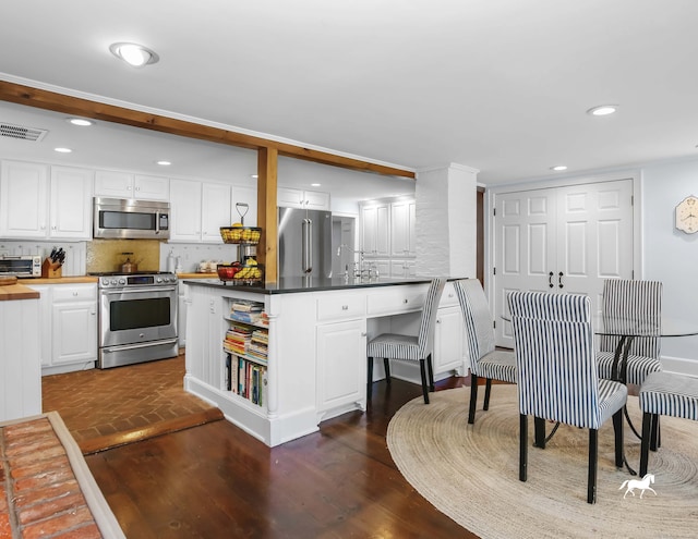 52 Wilton Rd E, Ridgefield, CT 06877 - dining space with dark wood-style floors and recessed lighting