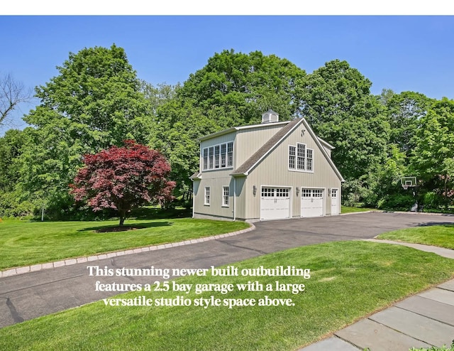 52 Wilton Rd E, Ridgefield, CT 06877 - view of front of house featuring a front lawn, a chimney, and driveway