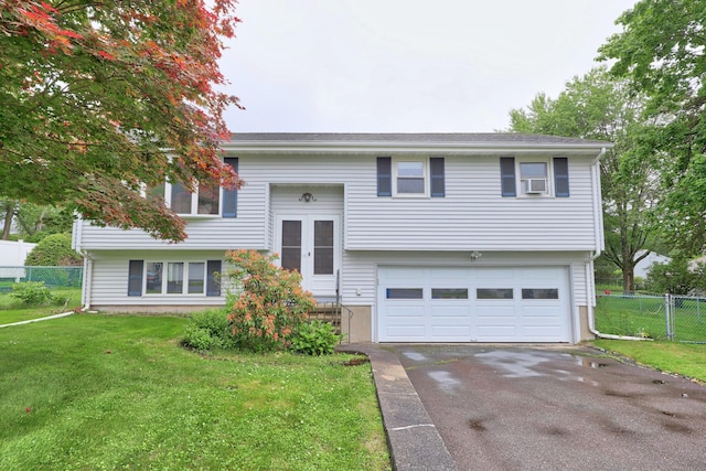 59 Litchfield Ln, Bristol, CT 06010 - split foyer home with a garage and asphalt driveway
