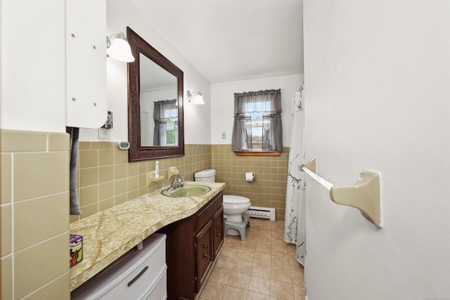 59 Litchfield Ln, Bristol, CT 06010 - bathroom with vanity, tile walls, a wainscoted wall, tile patterned flooring, and curtained shower
