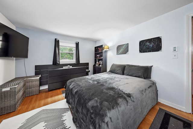 59 Litchfield Ln, Bristol, CT 06010 - bedroom with wood finished floors and baseboards