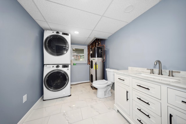 59 Litchfield Ln, Bristol, CT 06010 - washroom featuring stacked washer / drying machine, heat pump water heater, and light marble finish flooring