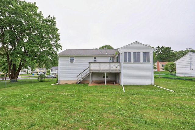 59 Litchfield Ln, Bristol, CT 06010 - rear view of house featuring stairway, a sunroom, and a wooden deck