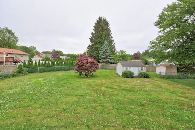 59 Litchfield Ln, Bristol, CT 06010 - fenced backyard featuring a storage shed