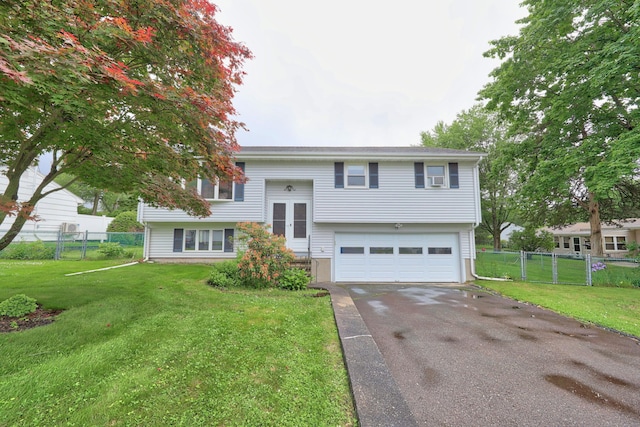 59 Litchfield Ln, Bristol, CT 06010 - split foyer home with an attached garage and driveway