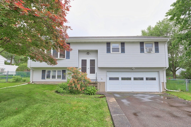 59 Litchfield Ln, Bristol, CT 06010 - split foyer home with asphalt driveway and a garage