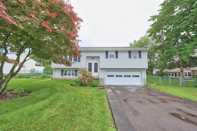 59 Litchfield Ln, Bristol, CT 06010 - bi-level home with driveway and an attached garage