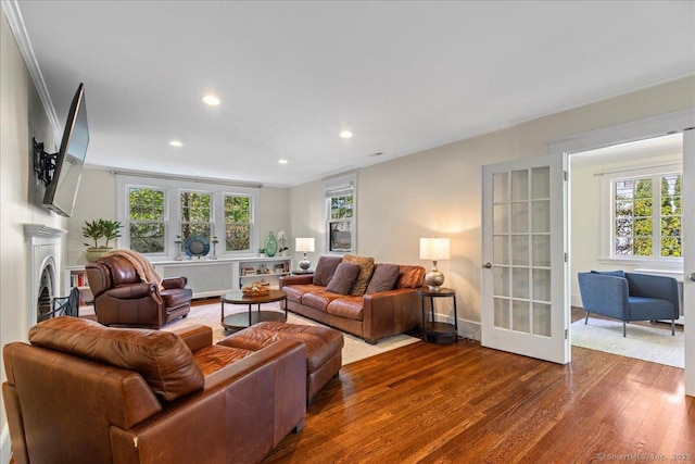 203 Ridgewood Ave, Hamden, CT 06517 - living area with dark wood finished floors, recessed lighting, healthy amount of natural light, and french doors