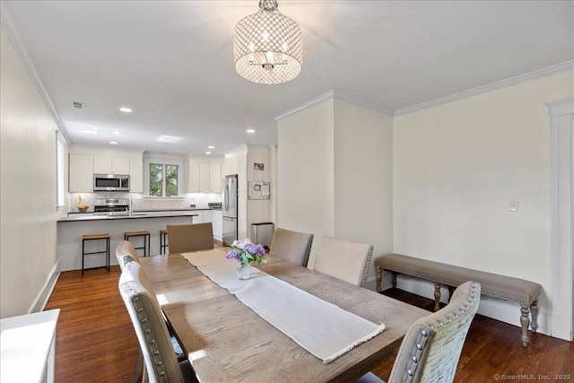 203 Ridgewood Ave, Hamden, CT 06517 - dining room featuring a chandelier, ornamental molding, dark wood-type flooring, and recessed lighting