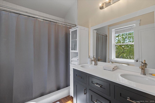 203 Ridgewood Ave, Hamden, CT 06517 - bathroom with double vanity and wood finished floors