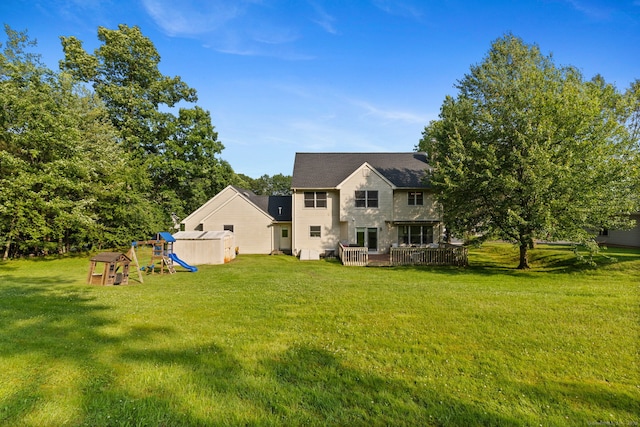 119 NW Dr, Plainville, CT 06062 - rear view of house with a playground, a yard, a wooden deck, and a shed