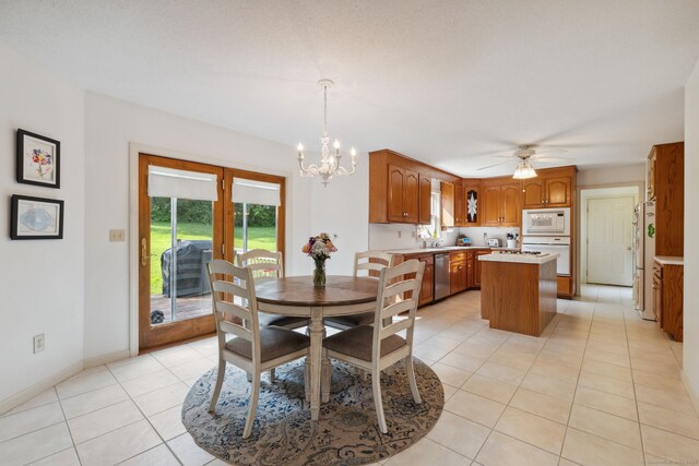 119 NW Dr, Plainville, CT 06062 - dining space featuring a chandelier, light tile patterned floors, and ceiling fan