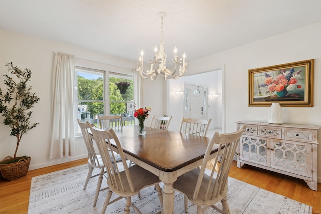 119 NW Dr, Plainville, CT 06062 - dining space with a chandelier and light wood-style floors