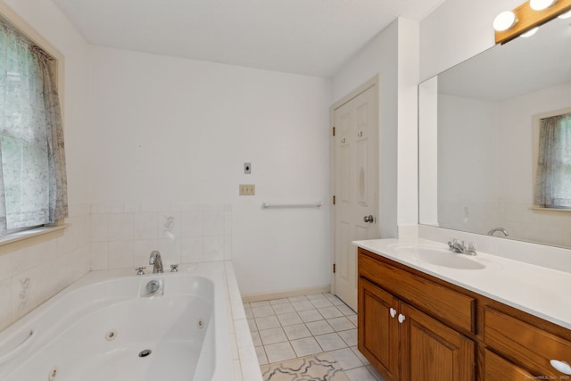 119 NW Dr, Plainville, CT 06062 - bathroom with a tub with jets, vanity, and tile patterned flooring