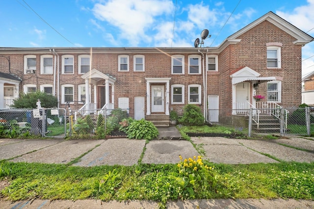 110 Asylum St, Bridgeport, CT 06610 - multi unit property featuring a gate, a fenced front yard, and brick siding
