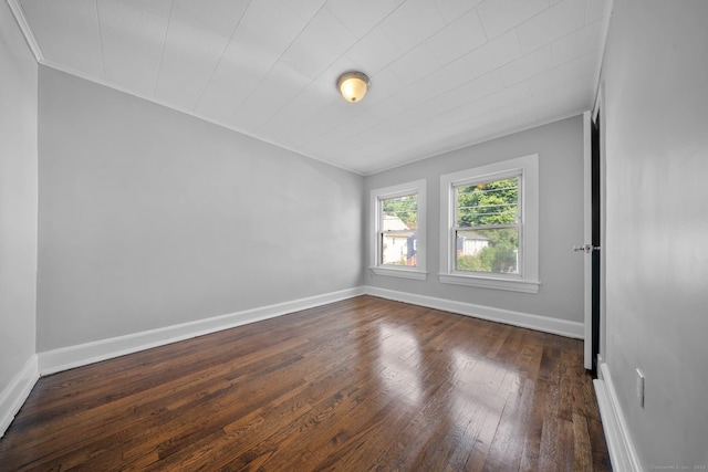 110 Asylum St, Bridgeport, CT 06610 - empty room featuring dark wood-style flooring and ornamental molding