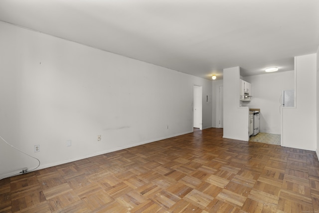 140 Grove St Unit 4F, Stamford, CT 06901 - unfurnished living room featuring baseboards