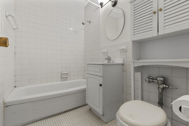 140 Grove St Unit 4F, Stamford, CT 06901 - full bathroom featuring tile walls, vanity, tile patterned flooring, and bathtub / shower combination