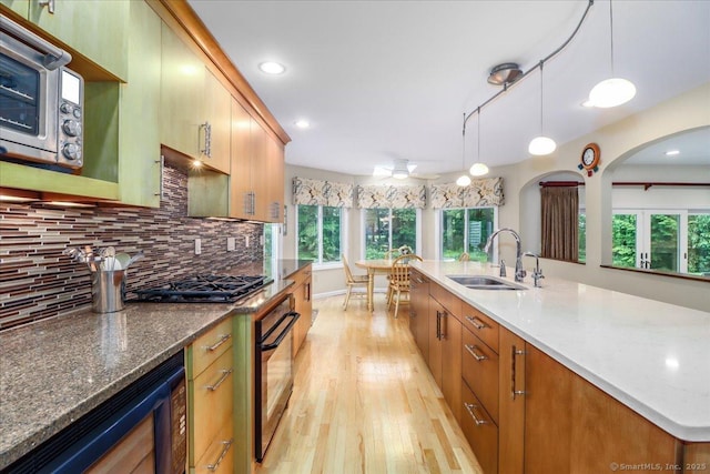 9 Maplewood Dr, Danbury, CT 06811 - kitchen featuring gas stovetop, light wood finished floors, black oven, healthy amount of natural light, and recessed lighting