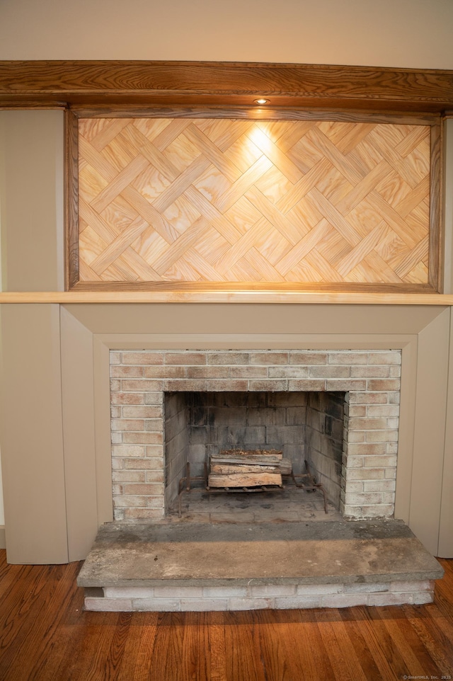 17 Valley Rd, Clinton, CT 06413 - detailed view of a brick fireplace and wood finished floors