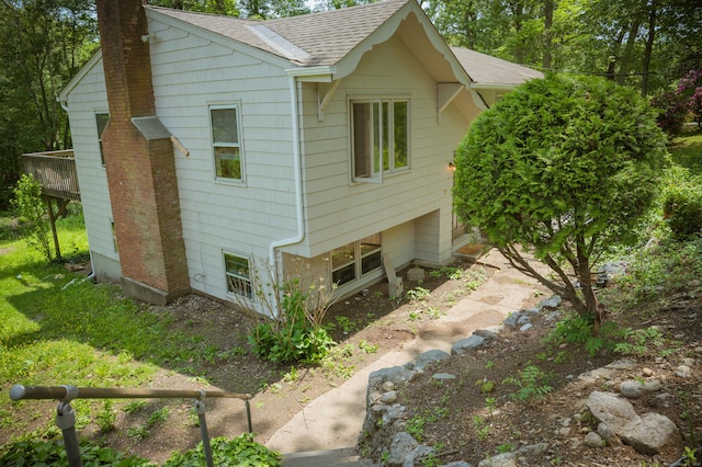 17 Valley Rd, Clinton, CT 06413 - view of property exterior with a chimney and a shingled roof