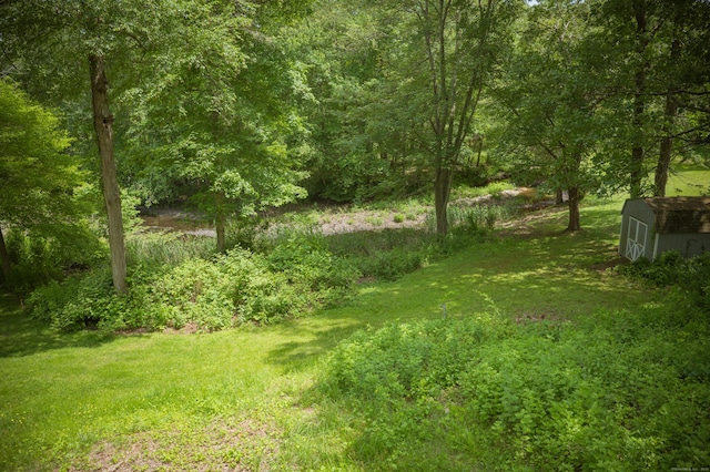 17 Valley Rd, Clinton, CT 06413 - view of grassy yard with a storage shed
