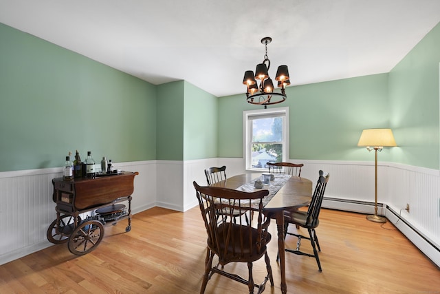 98 Aetna Ave, Torrington, CT 06790 - dining space featuring wainscoting, a chandelier, wood finished floors, and a baseboard heating unit