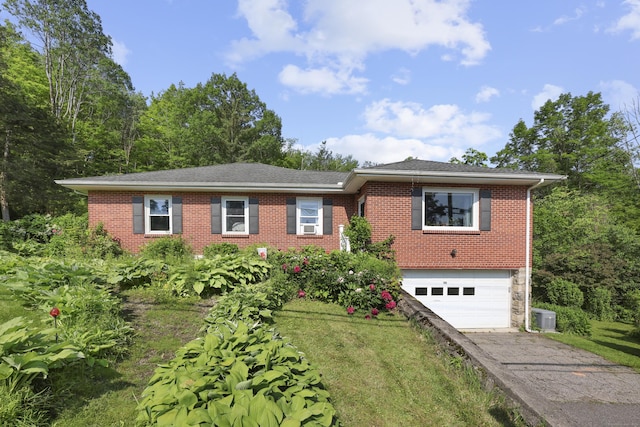 98 Aetna Ave, Torrington, CT 06790 - ranch-style home with asphalt driveway, a garage, brick siding, a front lawn, and roof with shingles