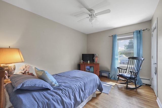 98 Aetna Ave, Torrington, CT 06790 - bedroom with wood finished floors, baseboard heating, and a ceiling fan