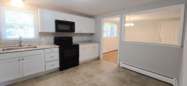 159 Windsorville Rd, South Windsor, CT 06074 - kitchen featuring black appliances, baseboard heating, light floors, and white cabinetry