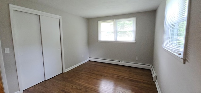 159 Windsorville Rd, South Windsor, CT 06074 - unfurnished bedroom featuring a closet, wood finished floors, and a baseboard radiator