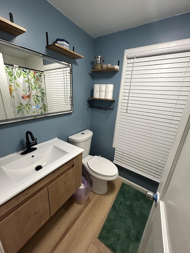 5 Sunnyslope Dr, Middletown, CT 06457 - full bathroom featuring wood finished floors, vanity, and a shower with shower curtain