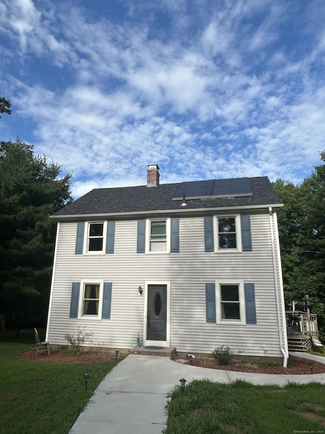 5 Sunnyslope Dr, Middletown, CT 06457 - colonial home with a chimney, solar panels, and a shingled roof