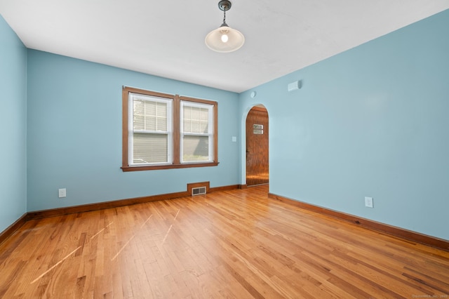 32 Franklin St, Southington, CT 06479 - empty room with arched walkways and light wood-type flooring