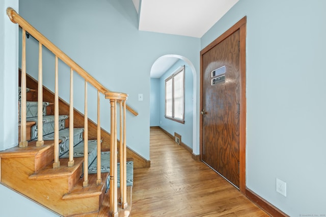 32 Franklin St, Southington, CT 06479 - entryway with arched walkways, wood finished floors, and stairway