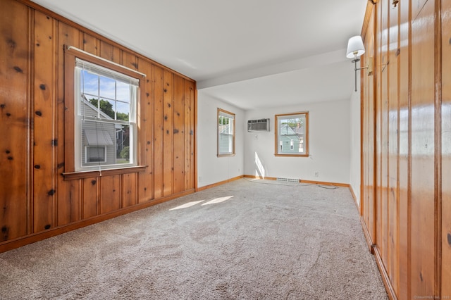 32 Franklin St, Southington, CT 06479 - carpeted empty room featuring plenty of natural light, a wall mounted air conditioner, and wooden walls
