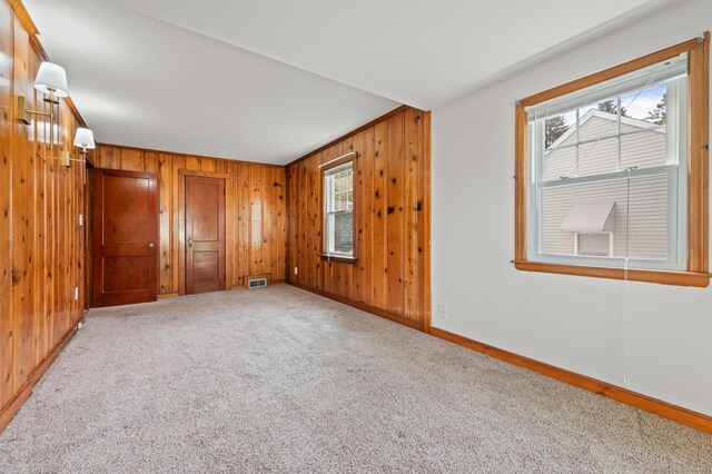 32 Franklin St, Southington, CT 06479 - unfurnished room featuring wooden walls, carpet, and healthy amount of natural light