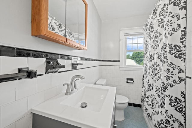 32 Franklin St, Southington, CT 06479 - bathroom featuring tile walls, vanity, a shower with curtain, wainscoting, and tile patterned floors