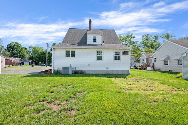 32 Franklin St, Southington, CT 06479 - back of house featuring a chimney, a yard, and roof with shingles