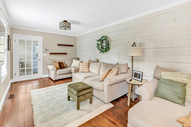 131 Long Hill Cross Rd, Shelton, CT 06484 - living area featuring crown molding, wood finished floors, healthy amount of natural light, and wooden walls